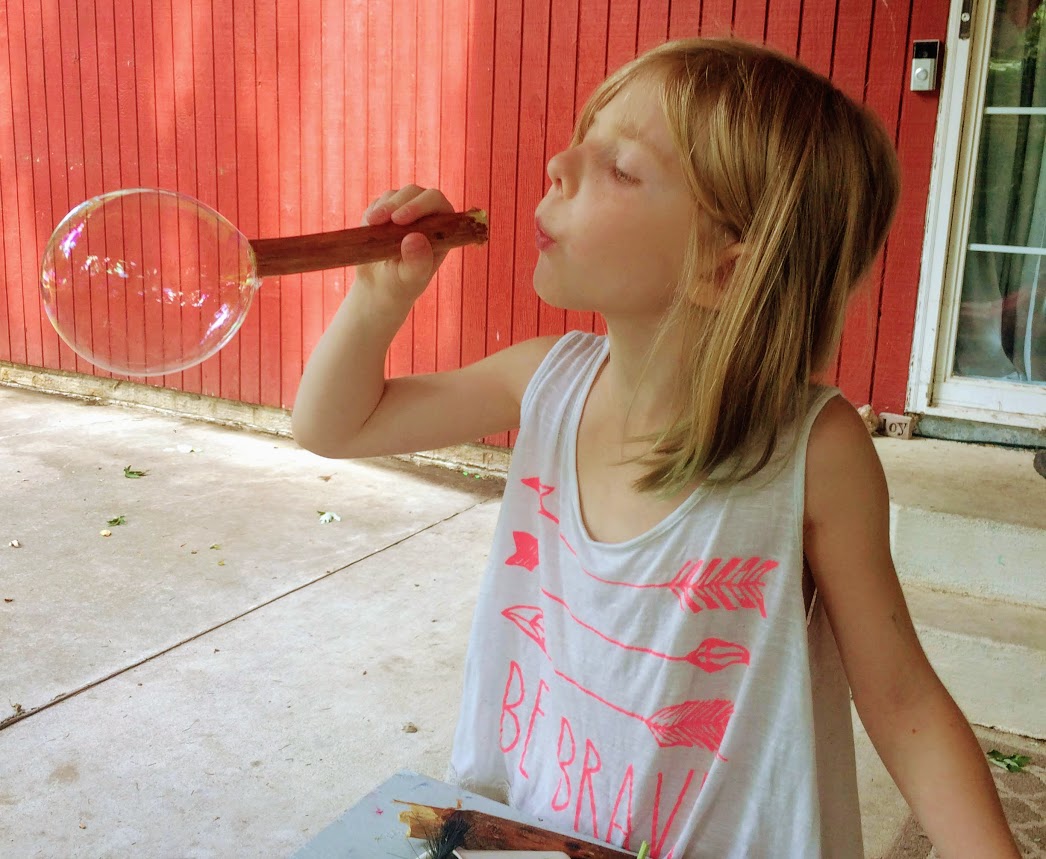 blowing bubbles with dock stalks